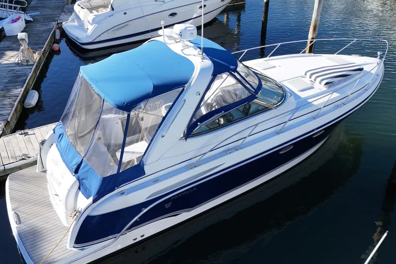 Slide: The Image of 2006 Formula 34 Performance Cruiser docked, showcasing sleek design and modern features. - 8