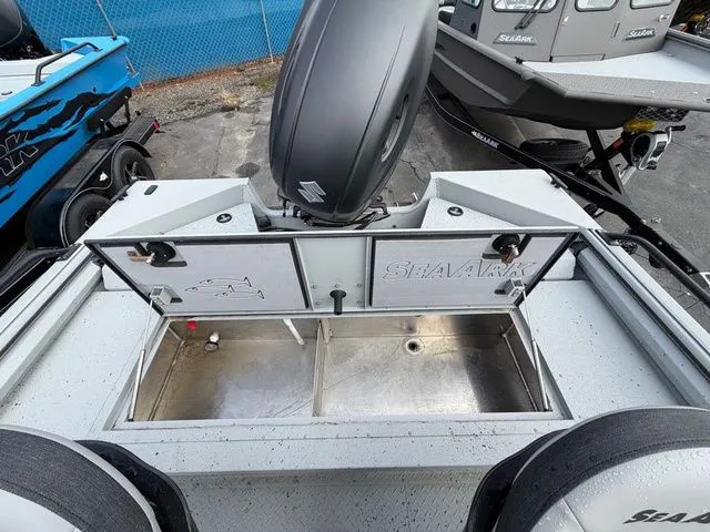 Slide: The Image of 2026 SeaArk Protege 200 with open storage compartment and motor. - 12