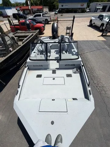 Slide: The Image of SeaArk Protege 200 boat, 2026 model, displayed in a parking lot. - 14