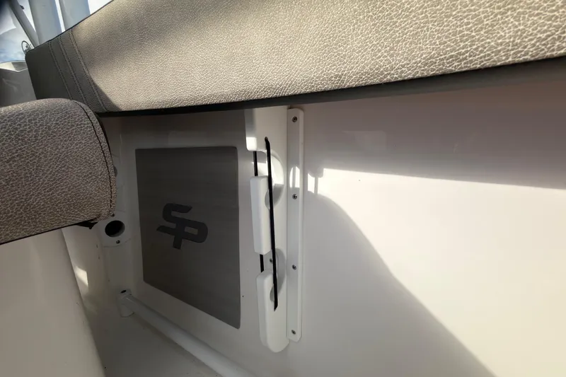 Slide: The Image of 2025 Seapro 240 DLX boat interior with logo and seating detail. - 22