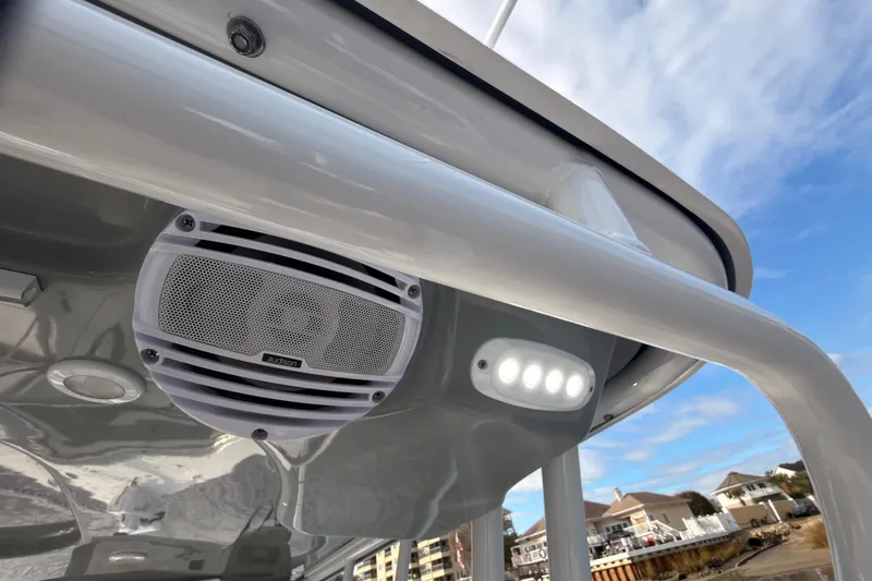 Slide: The Image of 2025 Seapro 240 DLX boat with speaker and LED lights under canopy. - 23