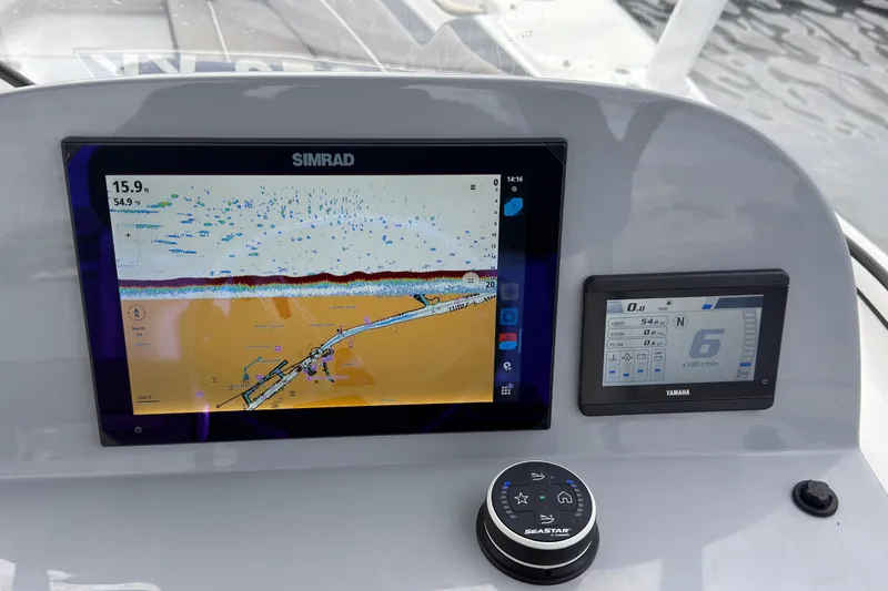 Slide: The Image of Dashboard of 2025 Seapro 240 DLX with Simrad and Yamaha displays. - 26