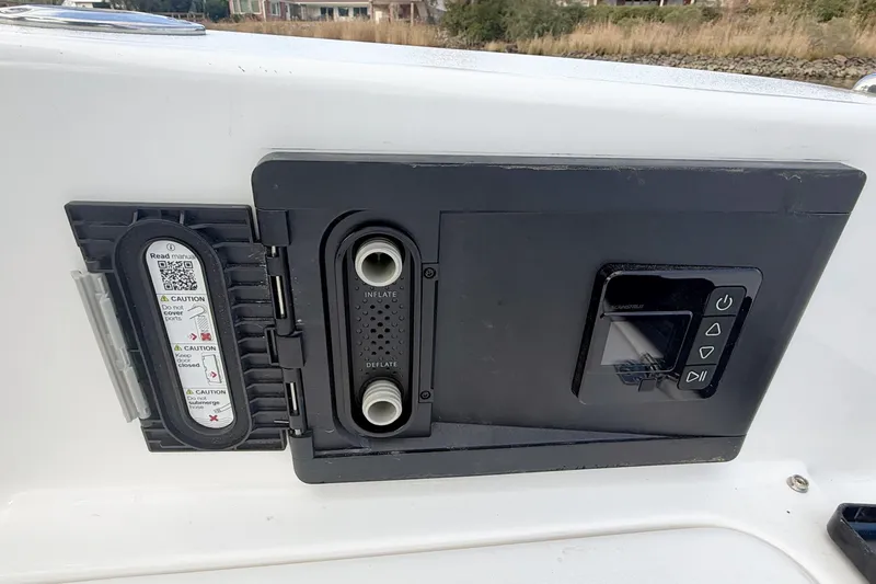 Slide: The Image of Control panel on 2025 Seapro 240 DLX boat, featuring inflate and deflate options. - 28