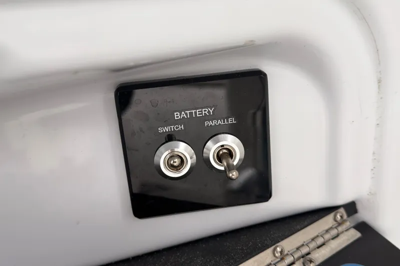 Slide: The Image of Battery switch panel on 2025 Seapro 240 DLX boat, featuring switch and parallel options. - 29