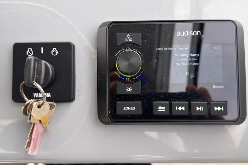 Slide: The Image of Control panel of 2025 Seapro 240 DLX with Yamaha ignition and Audison audio system. - 31