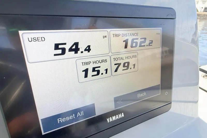 Slide: The Image of Yamaha display showing fuel usage and trip data on 2025 Seapro 240 DLX boat. - 8