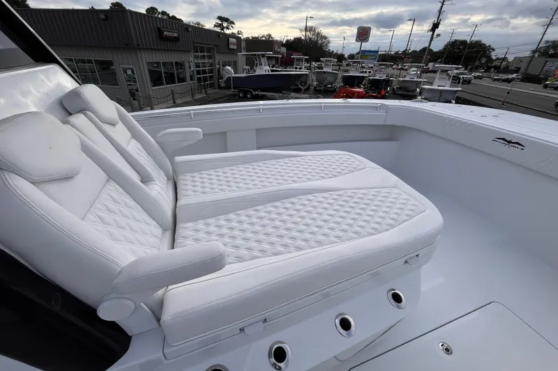 Slide: The Image of 2026 Invincible 33 Catamaran with luxurious white seating and modern design. - 18