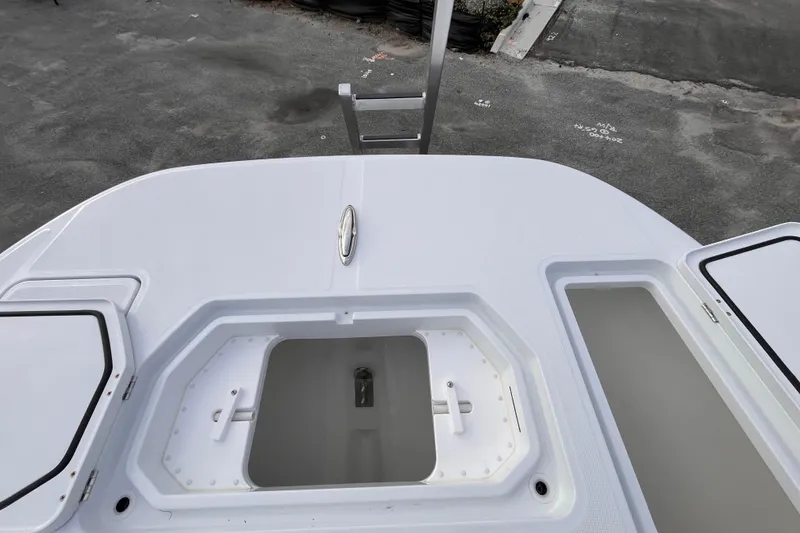 Slide: The Image of 2026 Invincible 33 Catamaran deck with open storage compartments. - 21