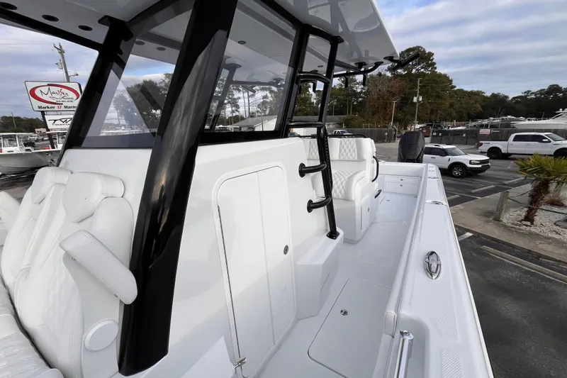 Slide: The Image of 2026 Invincible 33 Catamaran with sleek white interior and modern design features. - 24