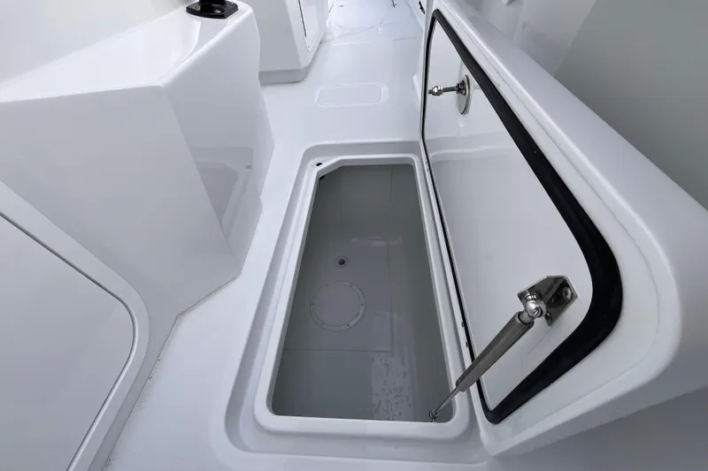 Slide: The Image of Open storage compartment on 2026 Invincible 33 Catamaran, showcasing sleek design and functionality. - 25