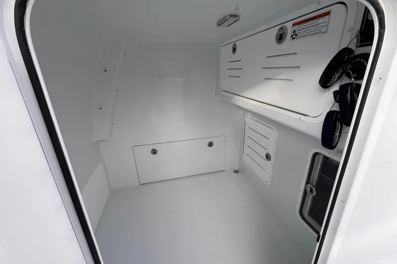 Slide: The Image of Interior of 2026 Invincible 33 Catamaran, featuring storage compartments and sleek design. - 26