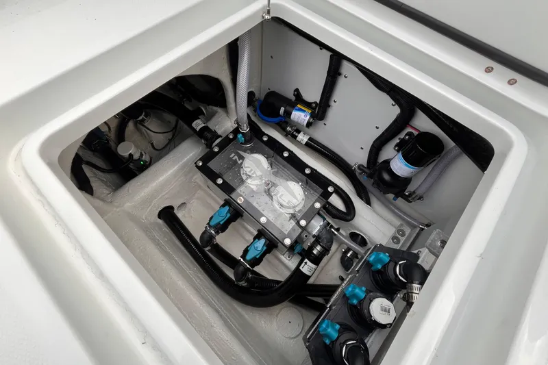Slide: The Image of 2026 Invincible 33 Catamaran engine compartment with advanced plumbing and wiring systems. - 29