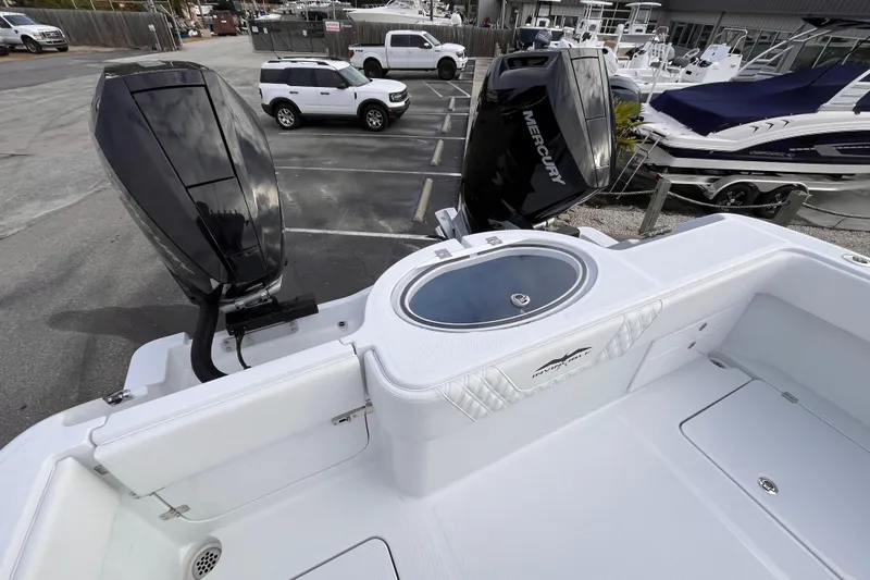 Slide: The Image of 2026 Invincible 33 Catamaran with dual Mercury outboard engines in a marina setting. - 7