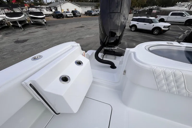 Slide: The Image of 2026 Invincible 33 Catamaran boat deck with engine and seating area. - 8