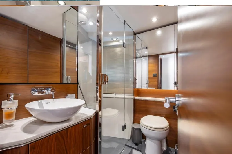 Slide: The Image of Luxurious 2017 Princess S65 yacht bathroom with modern fixtures and elegant wood paneling. - 13