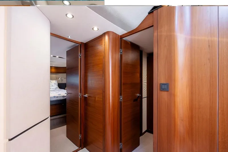 Slide: The Image of Luxurious wooden interior of 2017 Princess S65 yacht cabin hallway. - 17