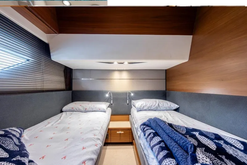 Slide: The Image of Luxurious 2017 Princess S65 yacht cabin with twin beds and modern decor. - 20