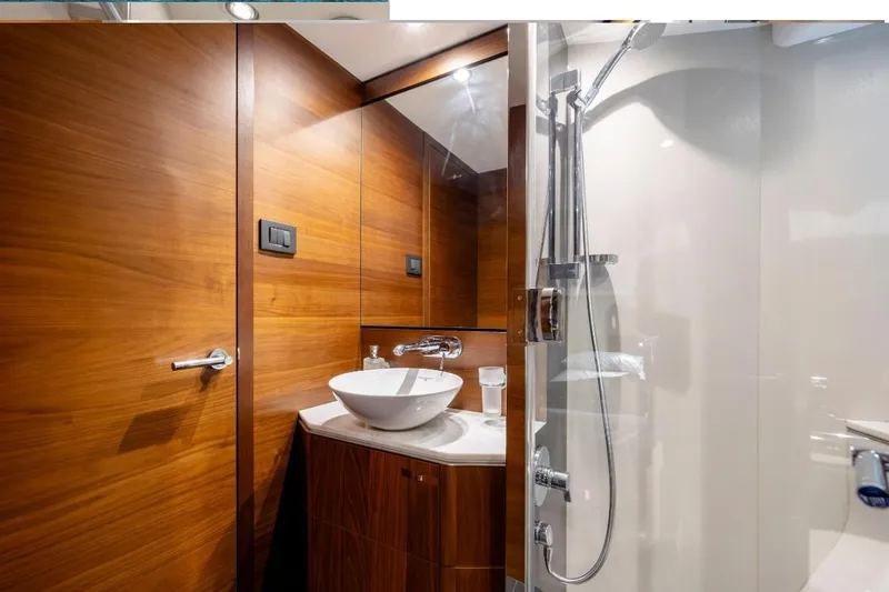 Slide: The Image of Luxurious 2017 Princess S65 yacht bathroom with wood paneling and modern fixtures. - 22
