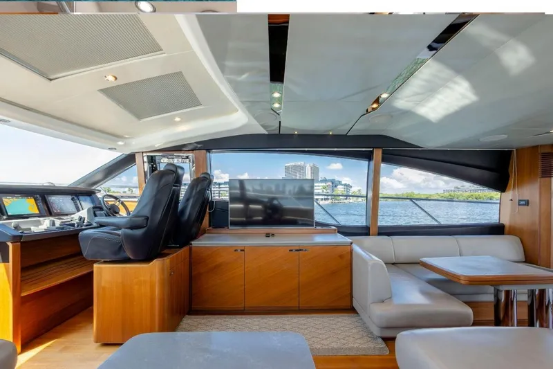 Slide: The Image of Luxurious interior of 2017 Princess S65 yacht with modern seating and panoramic windows. - 24