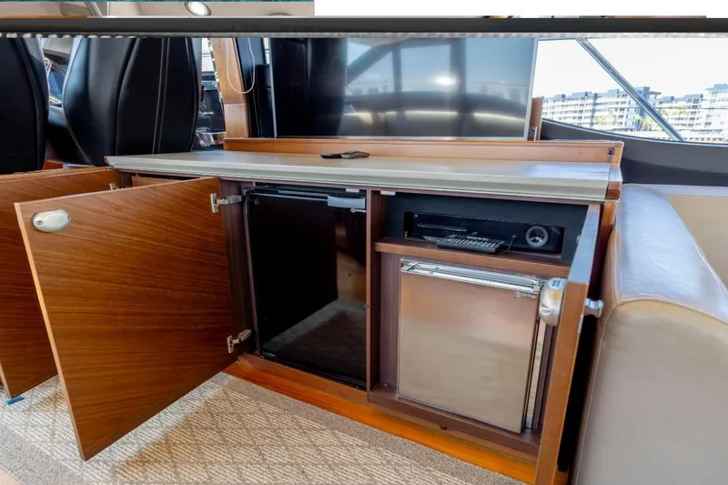 Slide: The Image of Luxurious interior of 2017 Princess S65 yacht with open cabinets and mini fridge. - 26