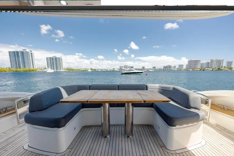 Slide: The Image of Luxurious 2017 Princess S65 yacht deck with seating, overlooking a scenic waterfront cityscape. - 29