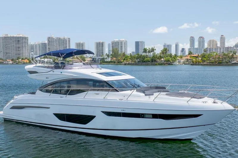 Slide: The Image of 2017 Princess S65 yacht cruising near city skyline, featuring sleek design and luxurious amenities. - 31