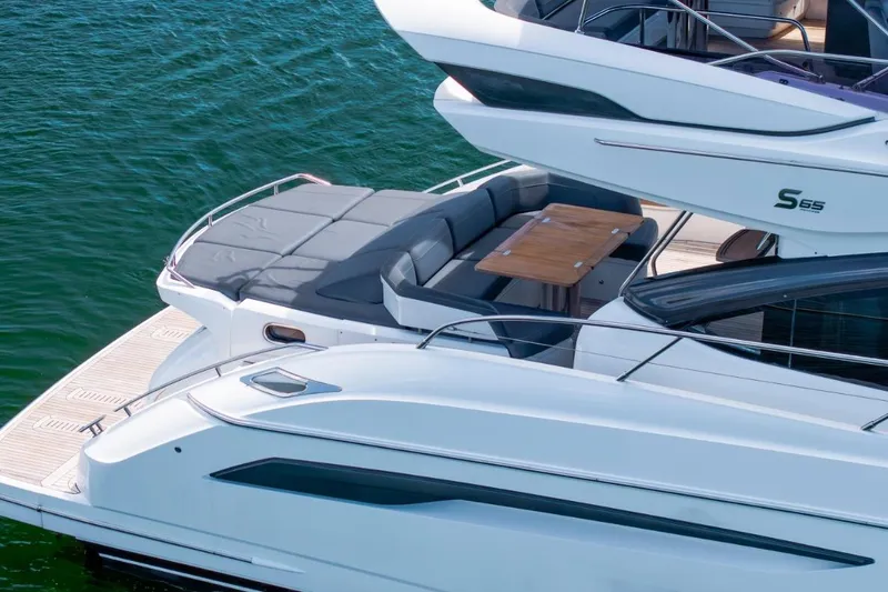 Slide: The Image of Luxury 2017 Princess S65 yacht with elegant deck and seating area on water. - 5