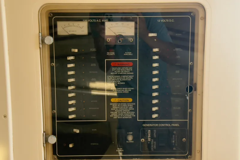 Slide: The Image of Electrical control panel on a 2005 Grady-White Express 330 boat. - 11
