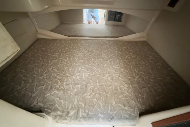 Slide: The Image of 2005 Grady-White Express 330 cabin interior with patterned mattress. - 15