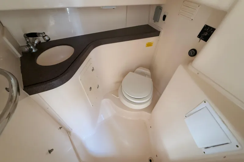 Slide: The Image of 2005 Grady-White Express 330 boat bathroom with sink and toilet. - 28