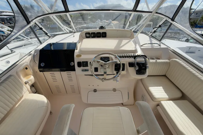 Slide: The Image of 2005 Grady-White Express 330 boat cockpit with steering wheel and seating. - 33
