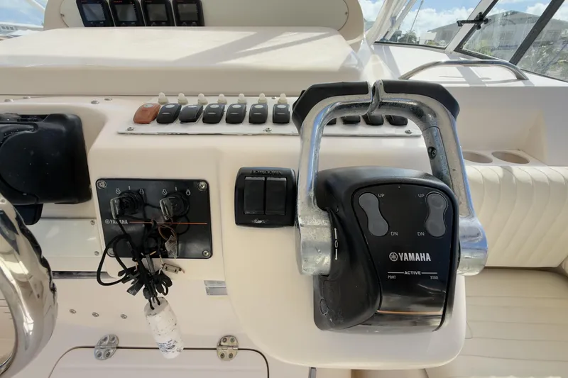 Slide: The Image of Control panel of a 2005 Grady-White Express 330 boat with Yamaha throttle. - 35
