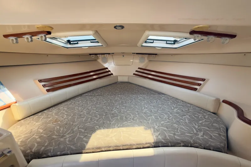 Slide: The Image of 2005 Grady-White Express 330 cabin interior with bed and skylights. - 4
