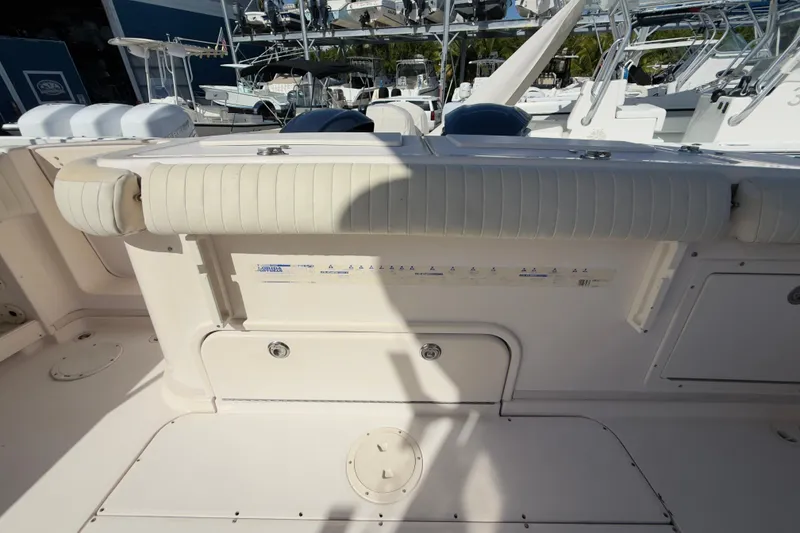 Slide: The Image of 2005 Grady-White Express 330 boat interior with cushioned seating and storage compartments. - 51
