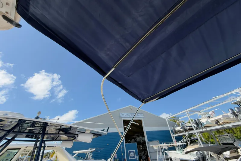 Slide: The Image of 2005 Grady-White Express 330 at marina under blue sky. - 54