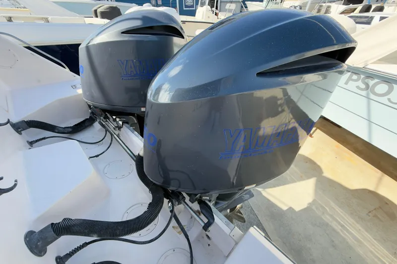 Slide: The Image of Twin Yamaha outboard engines on a 2005 Grady-White Express 330 boat. - 60