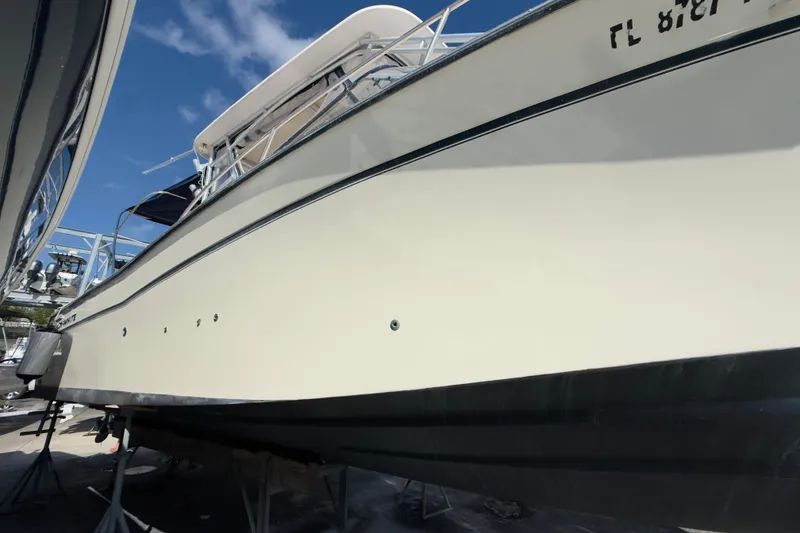 Slide: The Image of 2005 Grady-White Express 330 boat on stands under a clear blue sky. - 68