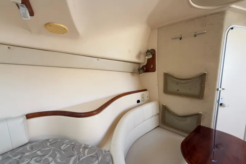 Slide: The Image of Interior cabin of 2005 Grady-White Express 330 boat, featuring seating and storage. - 9