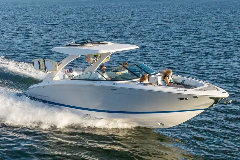 The Image of Manufacturer Provided Image: 2026 Regal LS9 Surf boat cruising on open water with passengers onboard. - 0