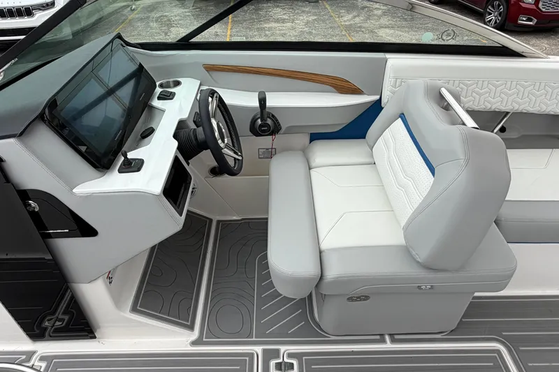 Slide: The Image of Interior of 2026 Regal LS9 Surf boat with modern dashboard and seating. - 15