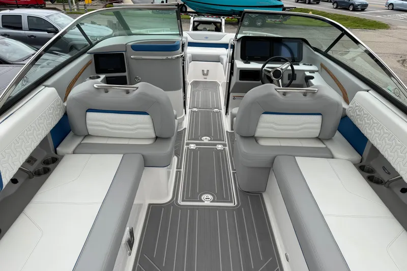Slide: The Image of 2026 Regal LS9 Surf boat interior with modern seating and sleek dashboard design. - 19