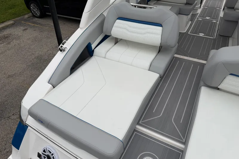 Slide: The Image of 2026 Regal LS9 Surf boat interior with gray and white seating and sleek flooring. - 22