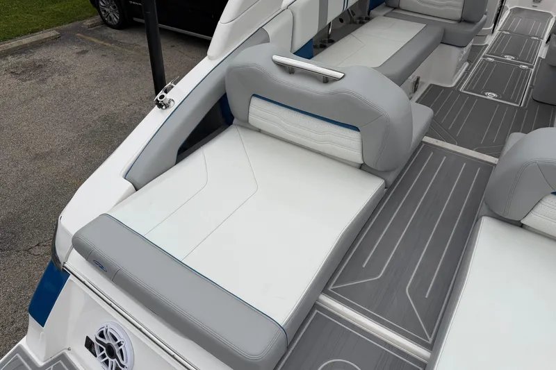 Slide: The Image of 2026 Regal LS9 Surf boat interior with gray and white seating, modern design. - 25