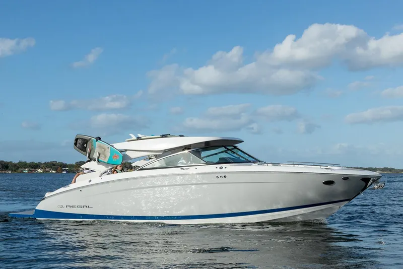 Slide: The Image of Manufacturer Provided Image: 2026 Regal LS9 Surf boat cruising on a sunny day with clear skies. - 3