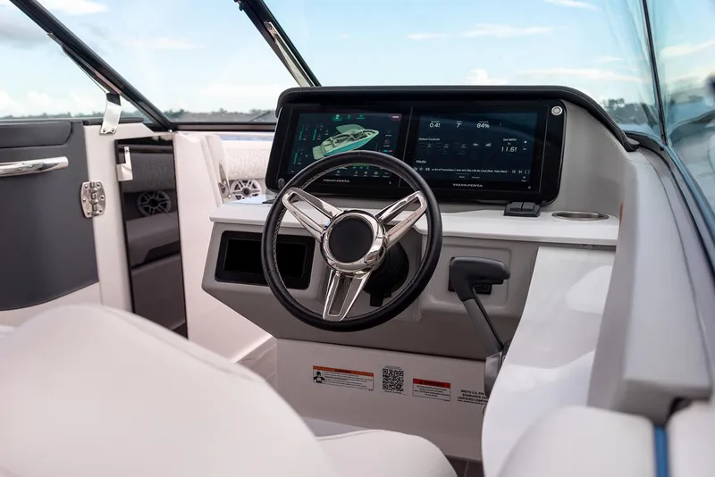Slide: The Image of Manufacturer Provided Image: 2026 Regal LS9 Surf boat interior with modern dashboard and steering wheel. - 5