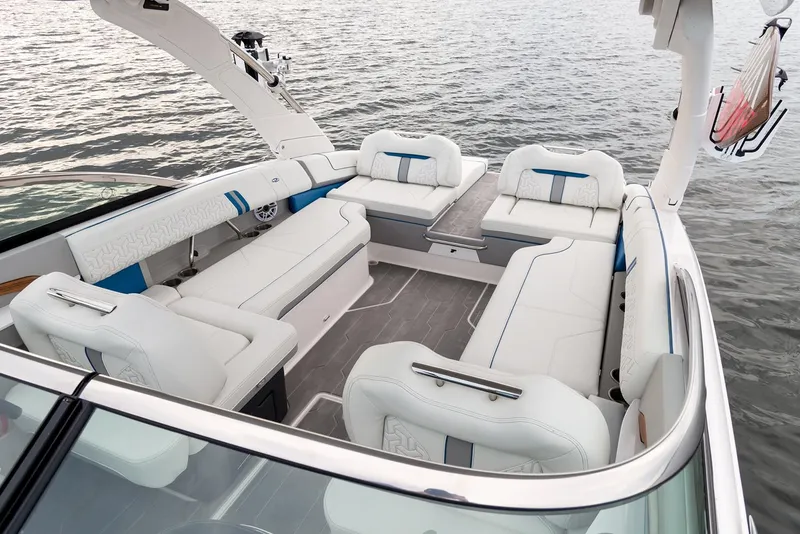 Slide: The Image of Manufacturer Provided Image: Luxurious interior of 2026 Regal LS9 Surf boat with spacious seating on calm water. - 7