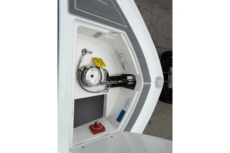 Slide: The Image of 2026 Regal LS9 Surf boat anchor compartment with winch and cleat. - 9