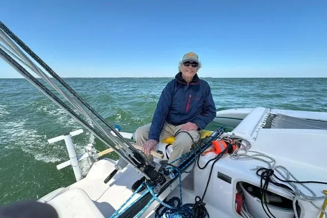 Slide: The Image of Person sailing Corsair Dash 750MKII trimaran on open water, clear blue sky, 2015 model. - 6