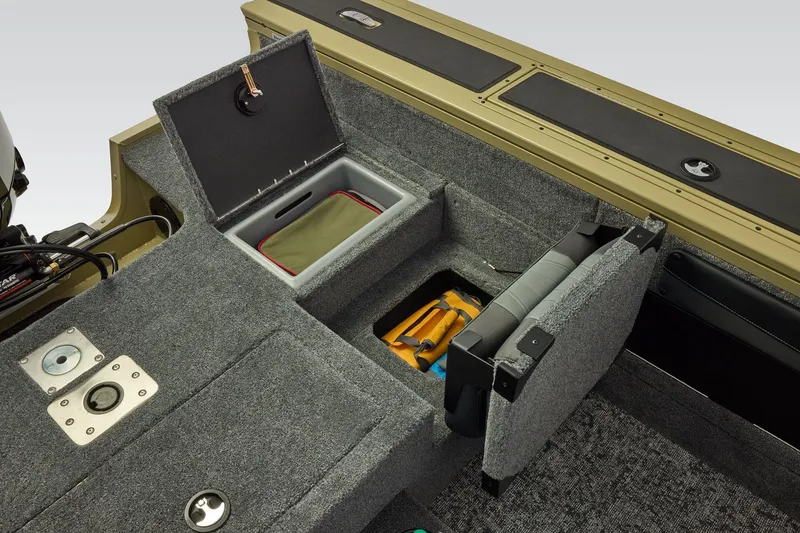 Slide: The Image of 2026 Tracker Targa V-19 Combo boat interior with storage compartments and seating. - 44