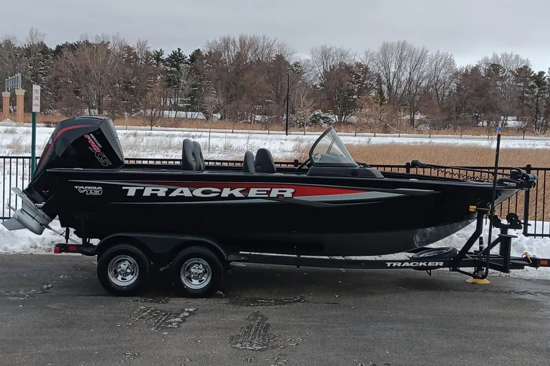 The Image of 2026 Tracker Targa V-19 Combo boat on trailer, parked in snowy outdoor setting. - 1